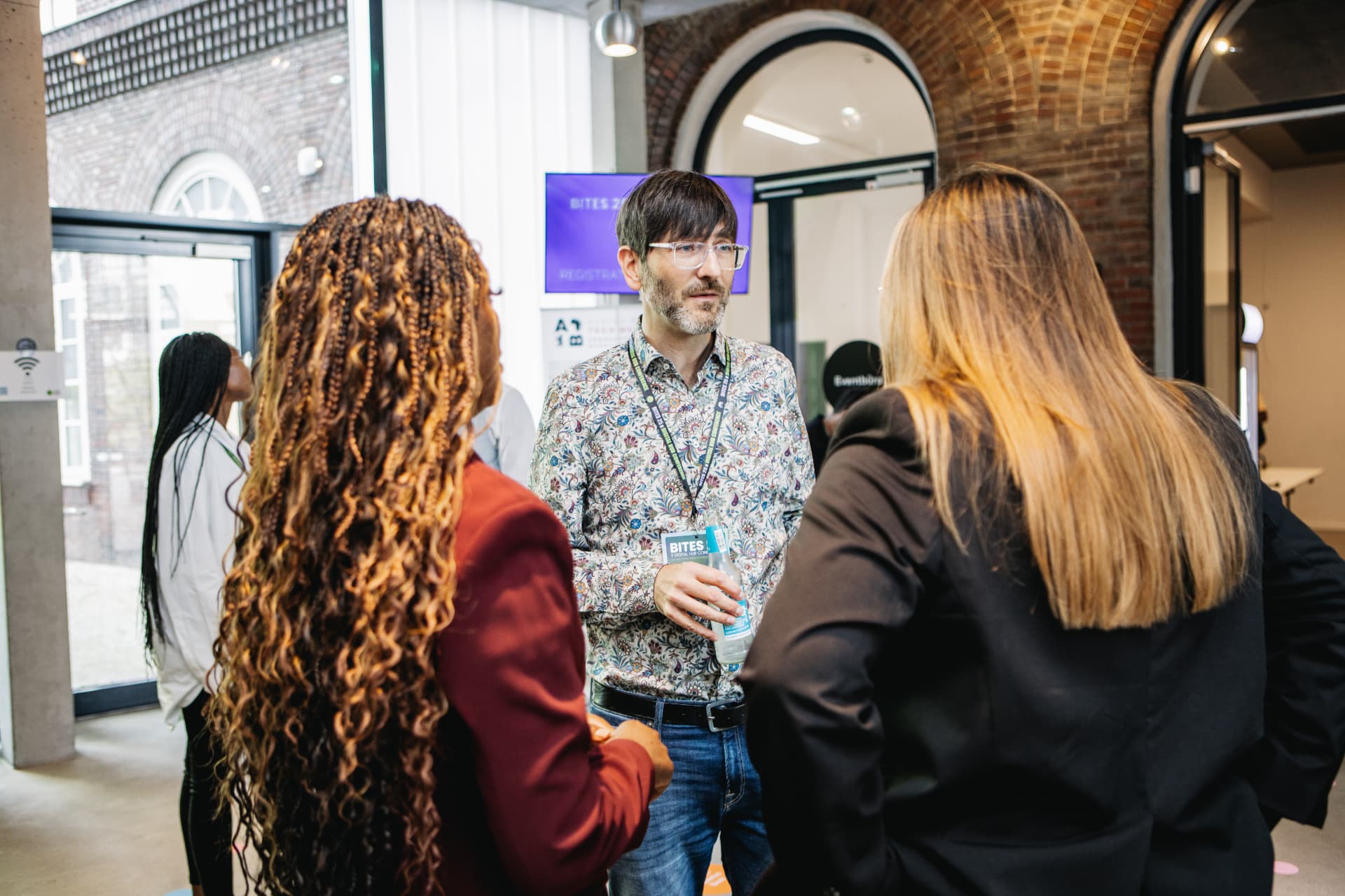 BITES attendees building connections during a networking conversation